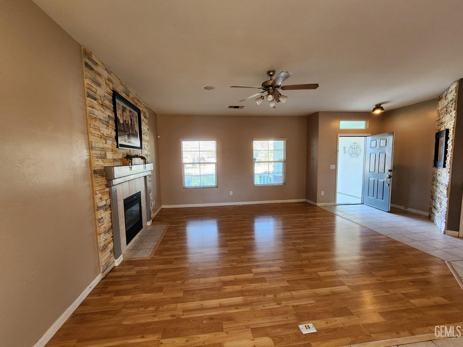 Undisclosed Address Bakersfield, CA 93313 - Photo 10 of 19 a view of a kitchen with a stove cabinets and wooden floor