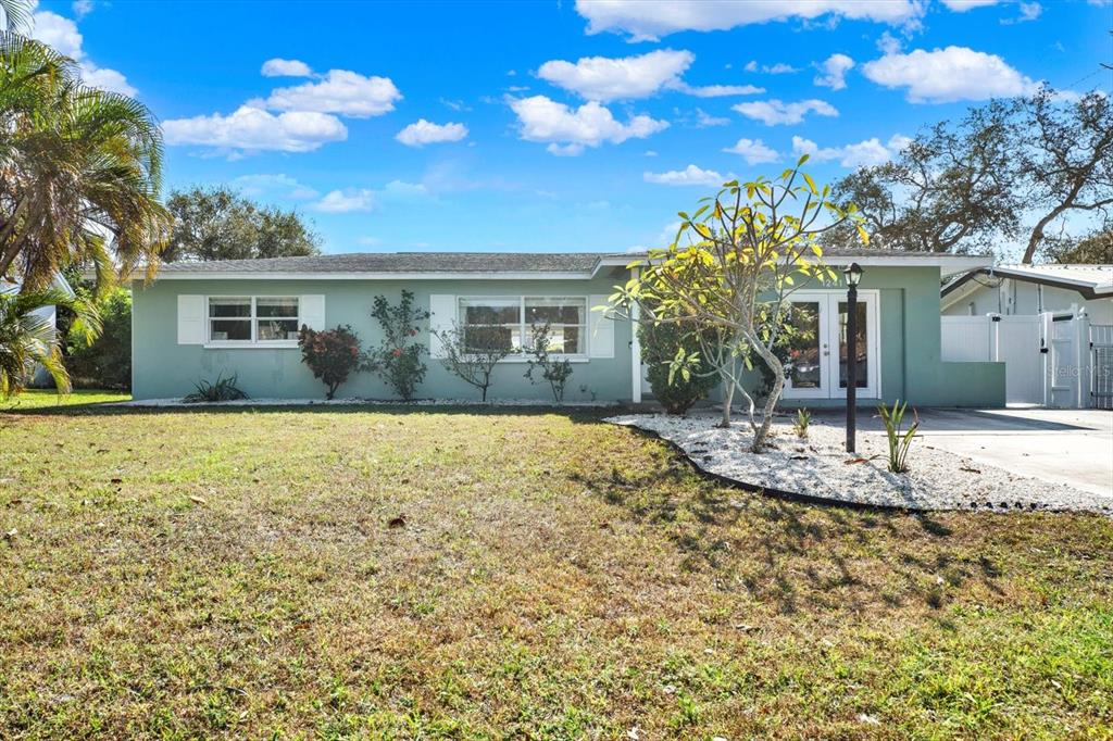 1241 12th Court Southwest Largo, FL 33770 - Photo 1 of 1 a view of a house with a yard