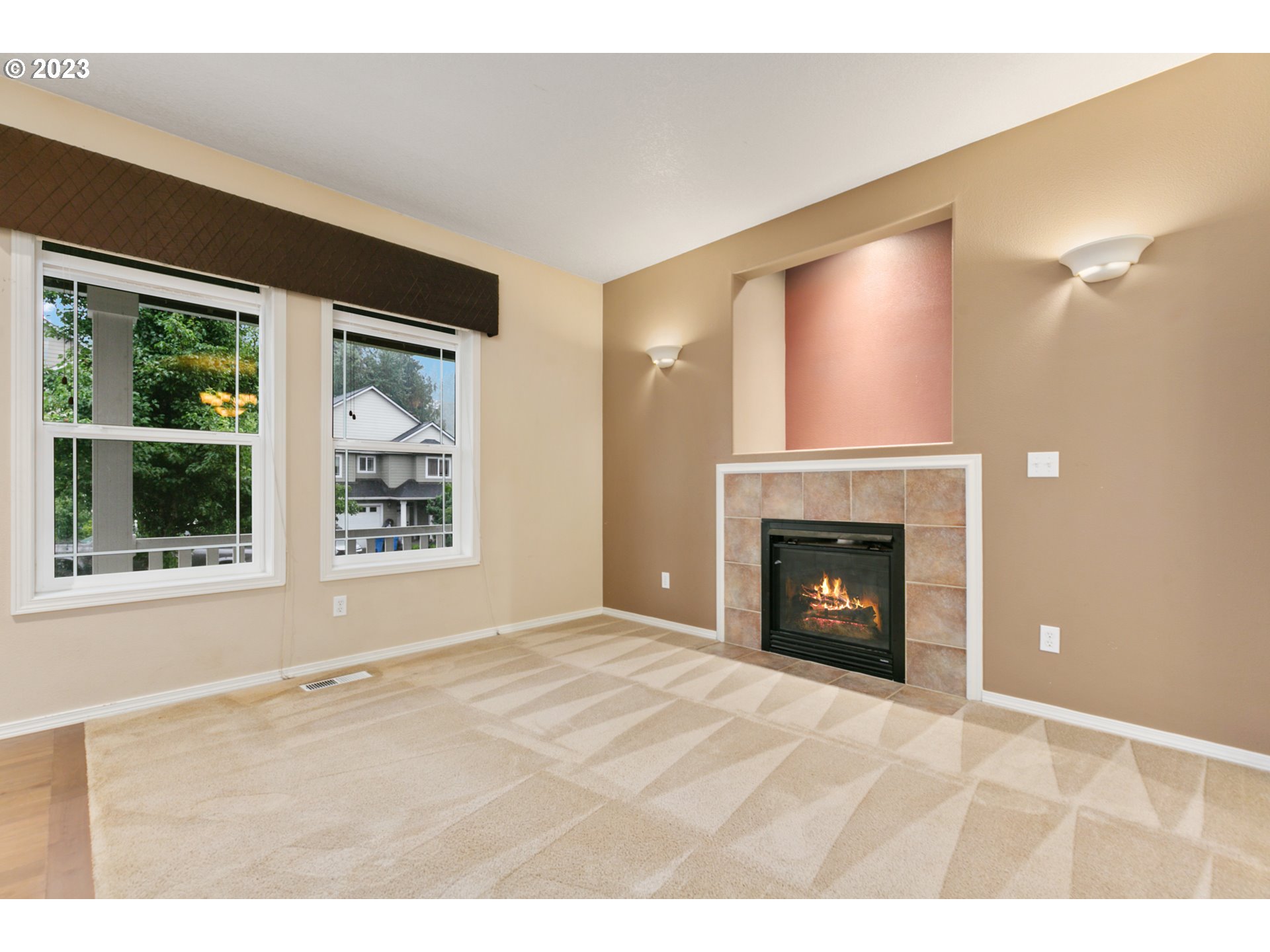 3314 South 2nd Way Ridgefield, WA 98642 - Photo 7 of 27 a view of an empty room with a window and a fireplace