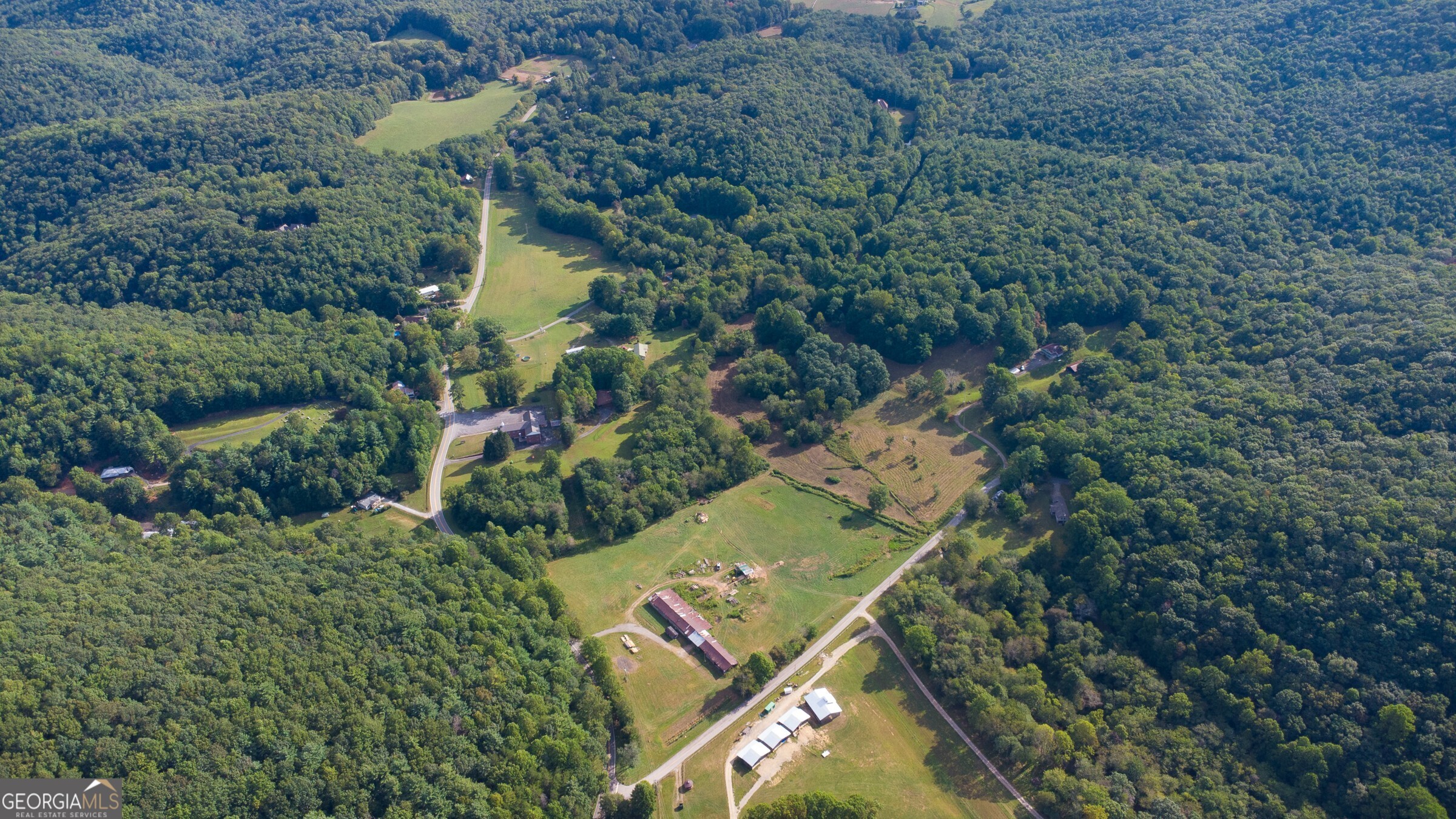 239 Glenn Elliott Road Dahlonega, GA 30533 - Photo 2 of 28 an aerial view of a house with a yard