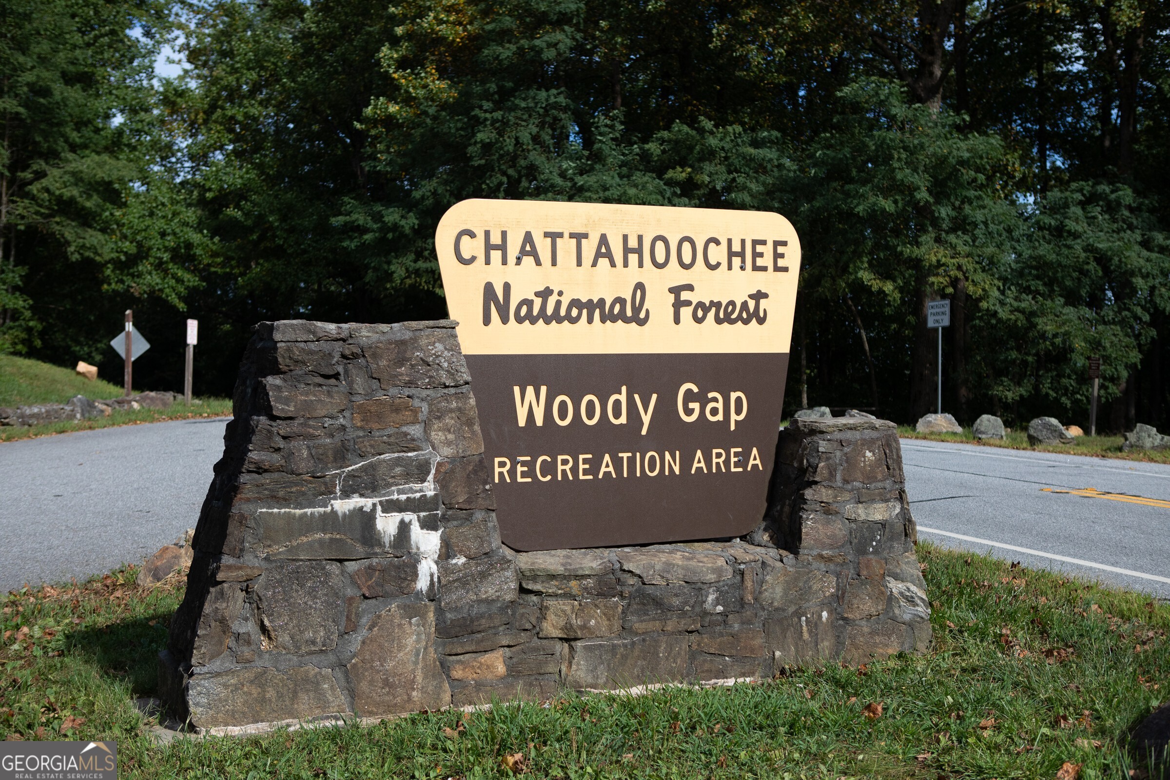 239 Glenn Elliott Road Dahlonega, GA 30533 - Photo 21 of 28 a sign on the side of a building