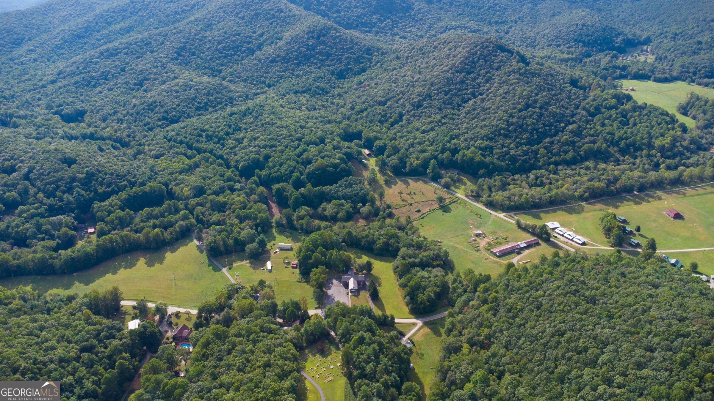 239 Glenn Elliott Road Dahlonega, GA 30533 - Photo 6 of 28 an aerial view of residential house with outdoor space and lake view