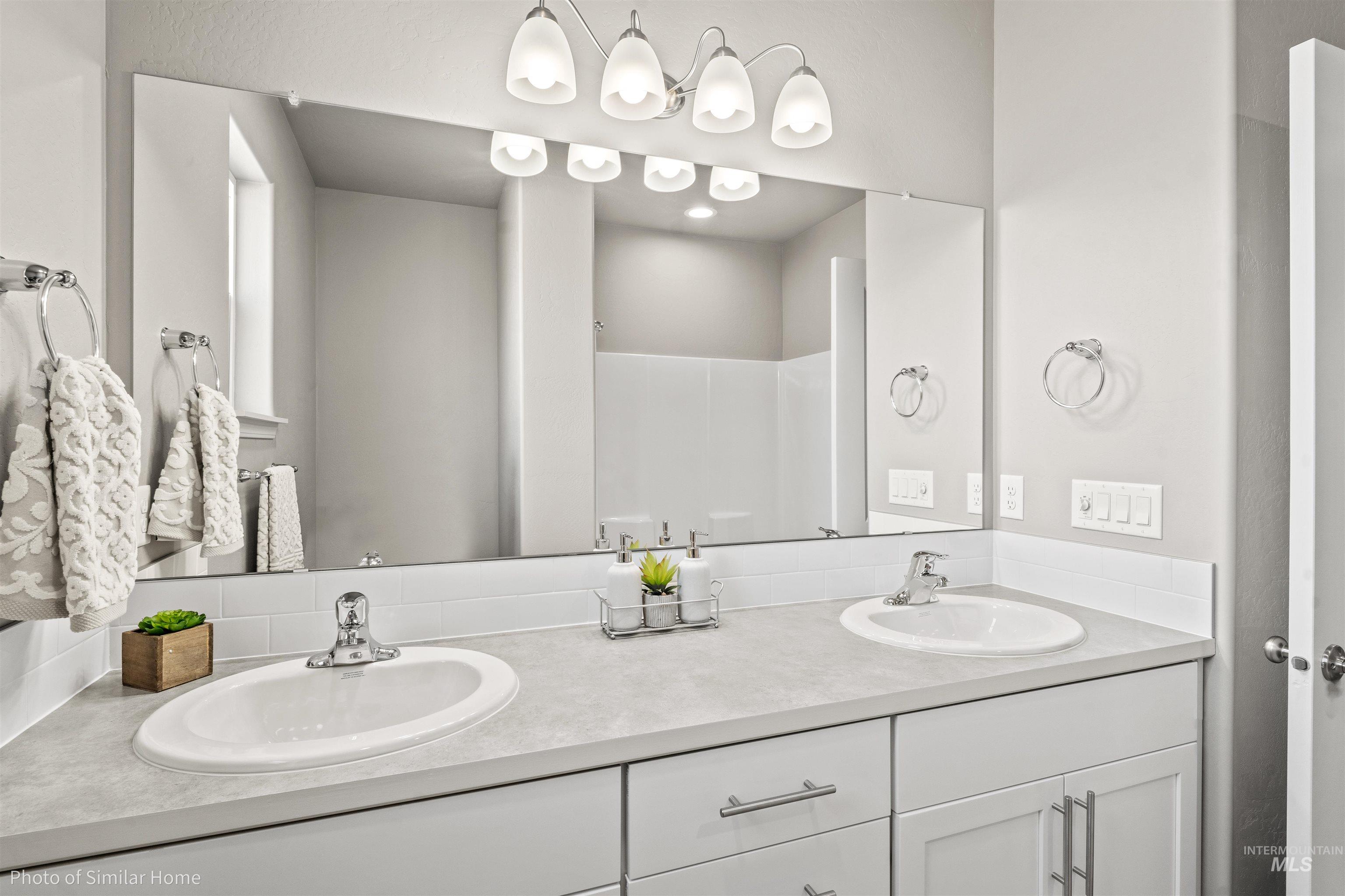382 West Gleason Court Meridian, ID 83646 - Photo 2 of 21 Bathroom with double vanity and a shower