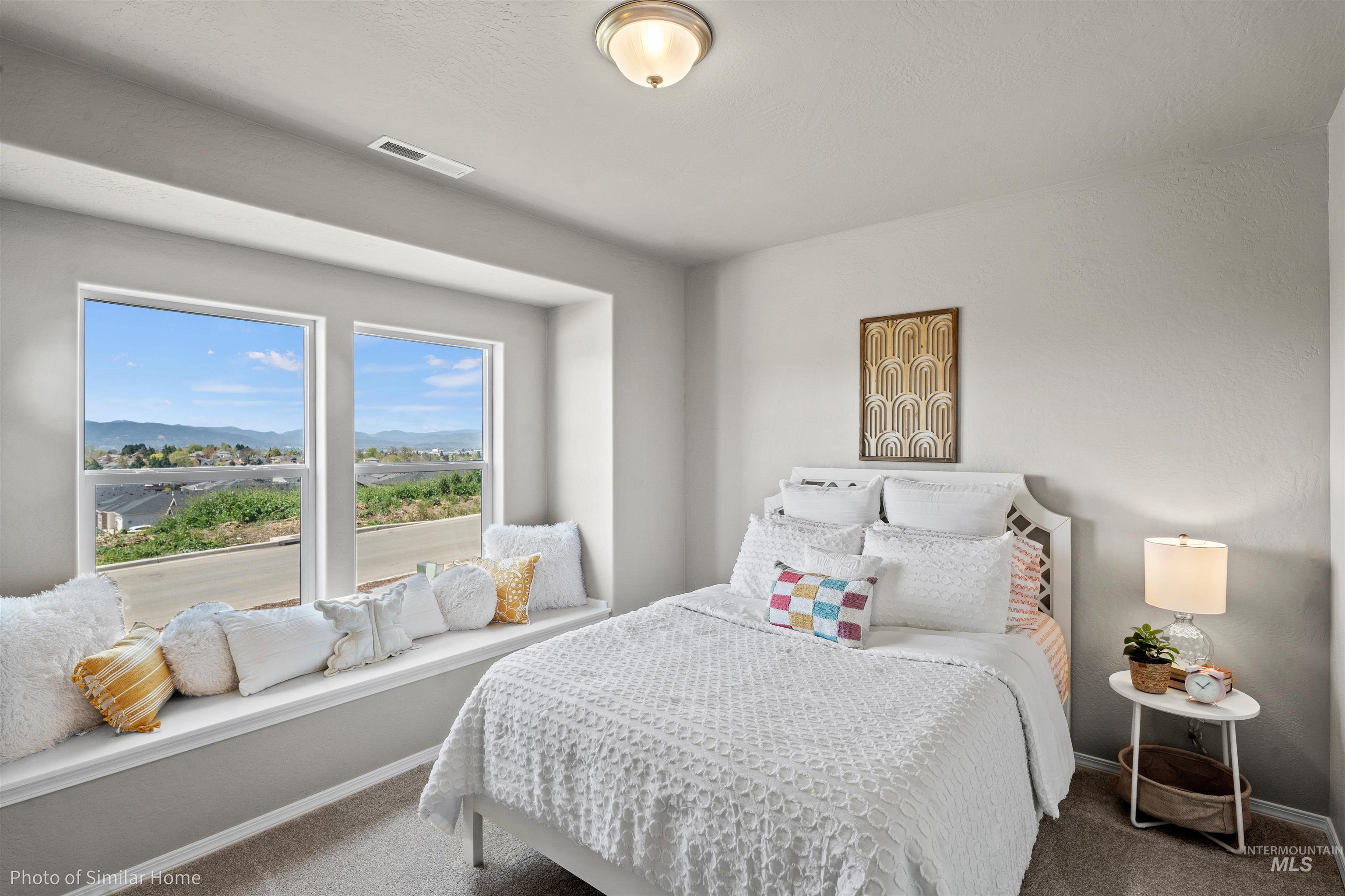 382 West Gleason Court Meridian, ID 83646 - Photo 3 of 21 Bedroom with a mountain view and carpet flooring