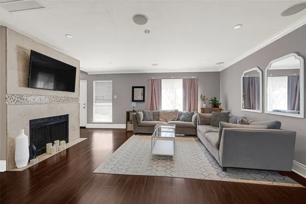 a living room with furniture and a fireplace