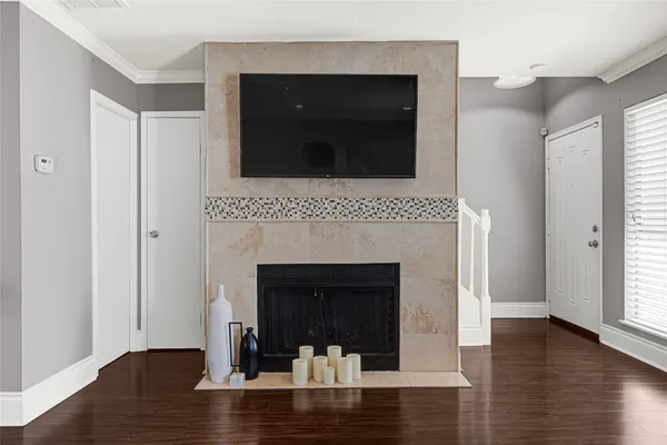 a living room with a fireplace and a table