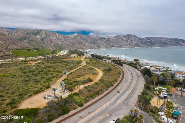 a view of a city with mountains in the background