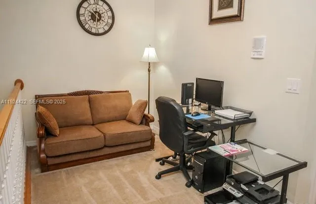 a work room with a couch and a desk