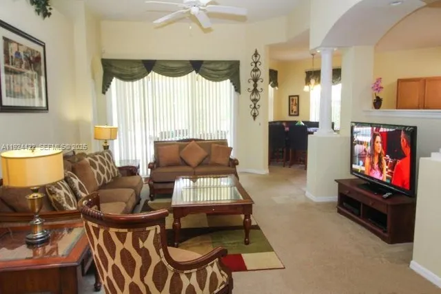 a living room with furniture and a flat screen tv