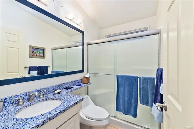 a bedroom with a bed and a chair