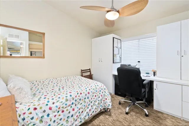 a sign that is sitting in front of flowers