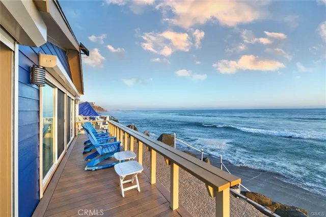 a kitchen with granite countertop a sink stove and cabinets