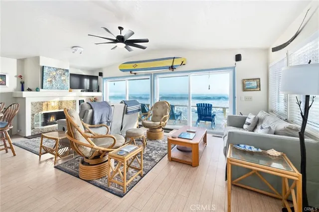 a living room with furniture fireplace and a table