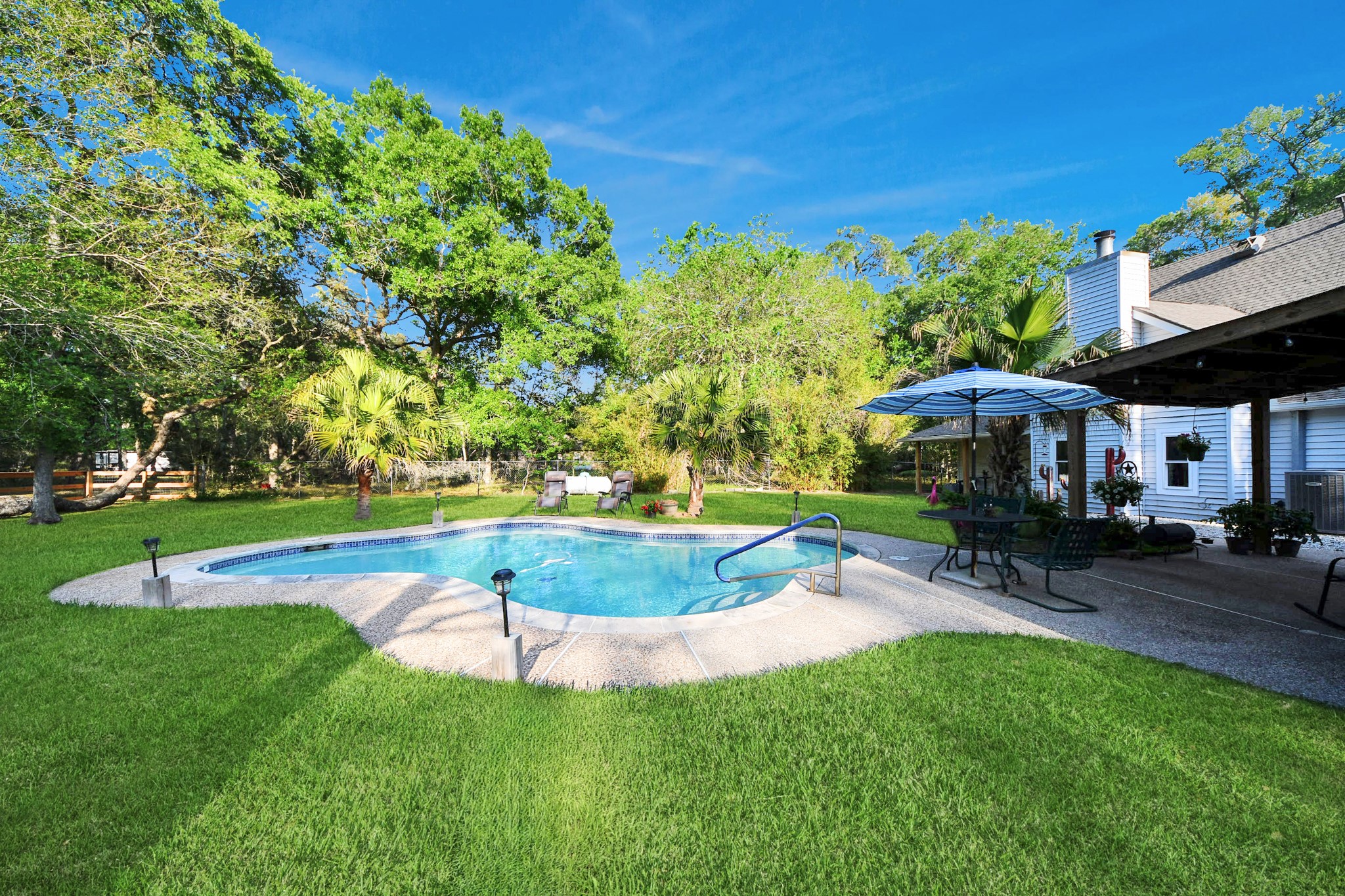 20202 Deer Run Road Damon, TX 77430 - Photo 40 of 45 This pool area feels like a private getaway.