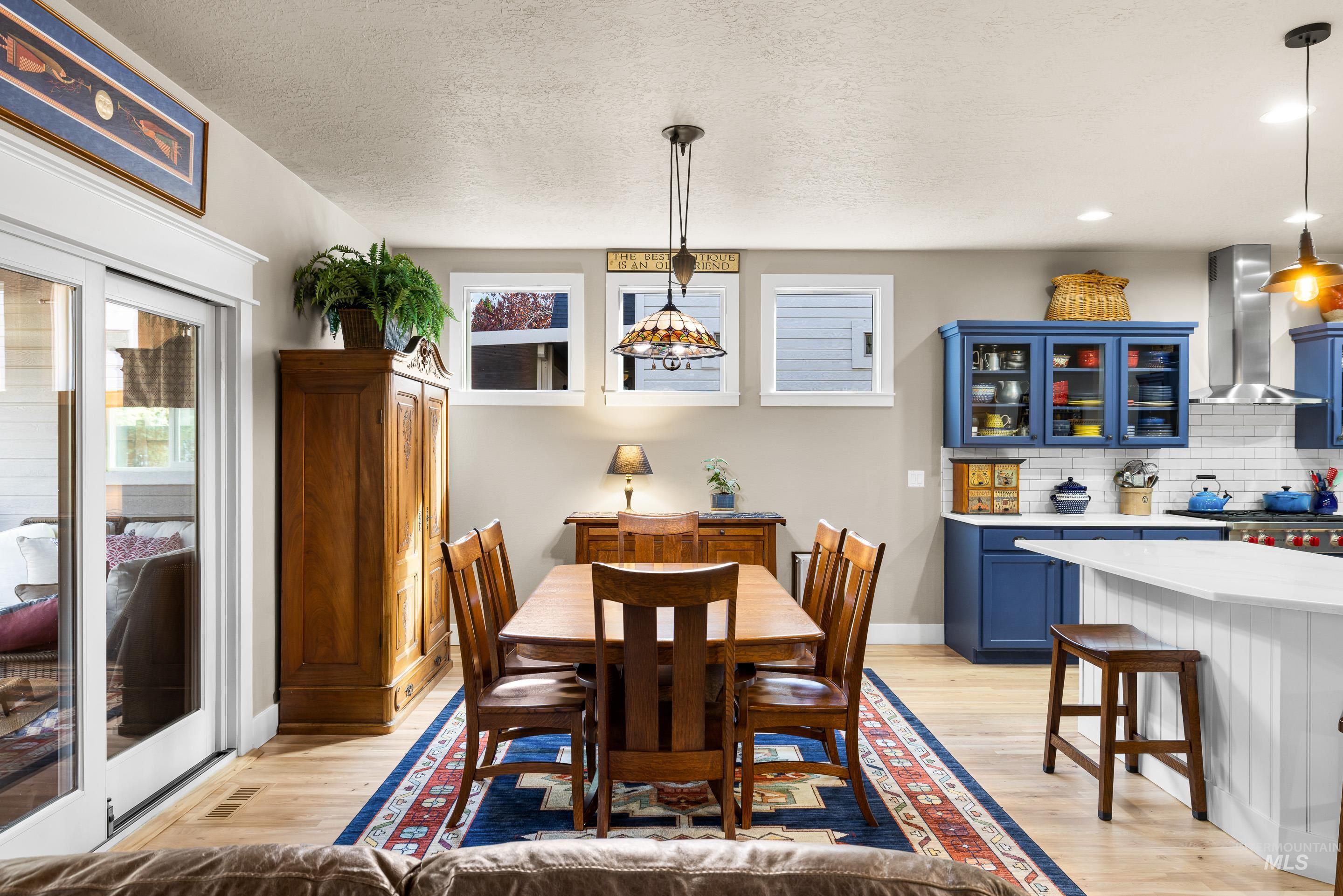 836 West Colbert Street Meridian, ID 83646 - Photo 18 of 45 Dining area featuring light wood-type flooring and a textured ceiling