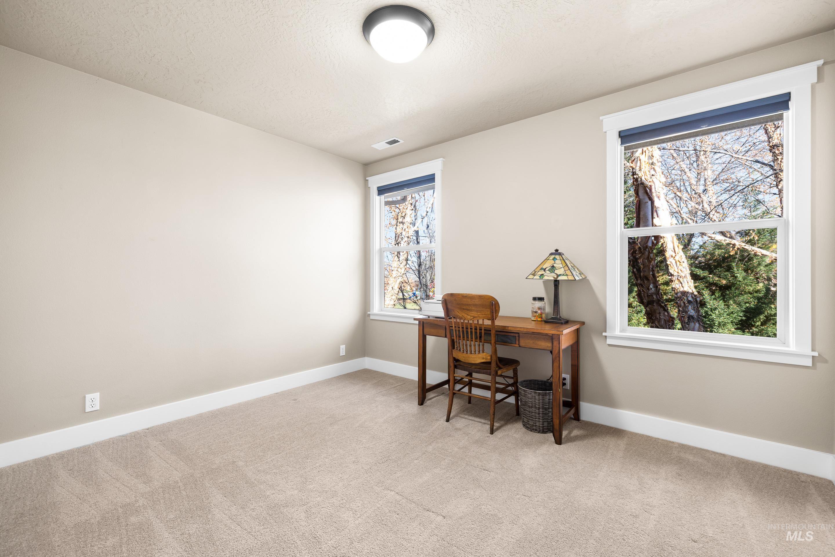 836 West Colbert Street Meridian, ID 83646 - Photo 29 of 45 Office area featuring light carpet and a textured ceiling