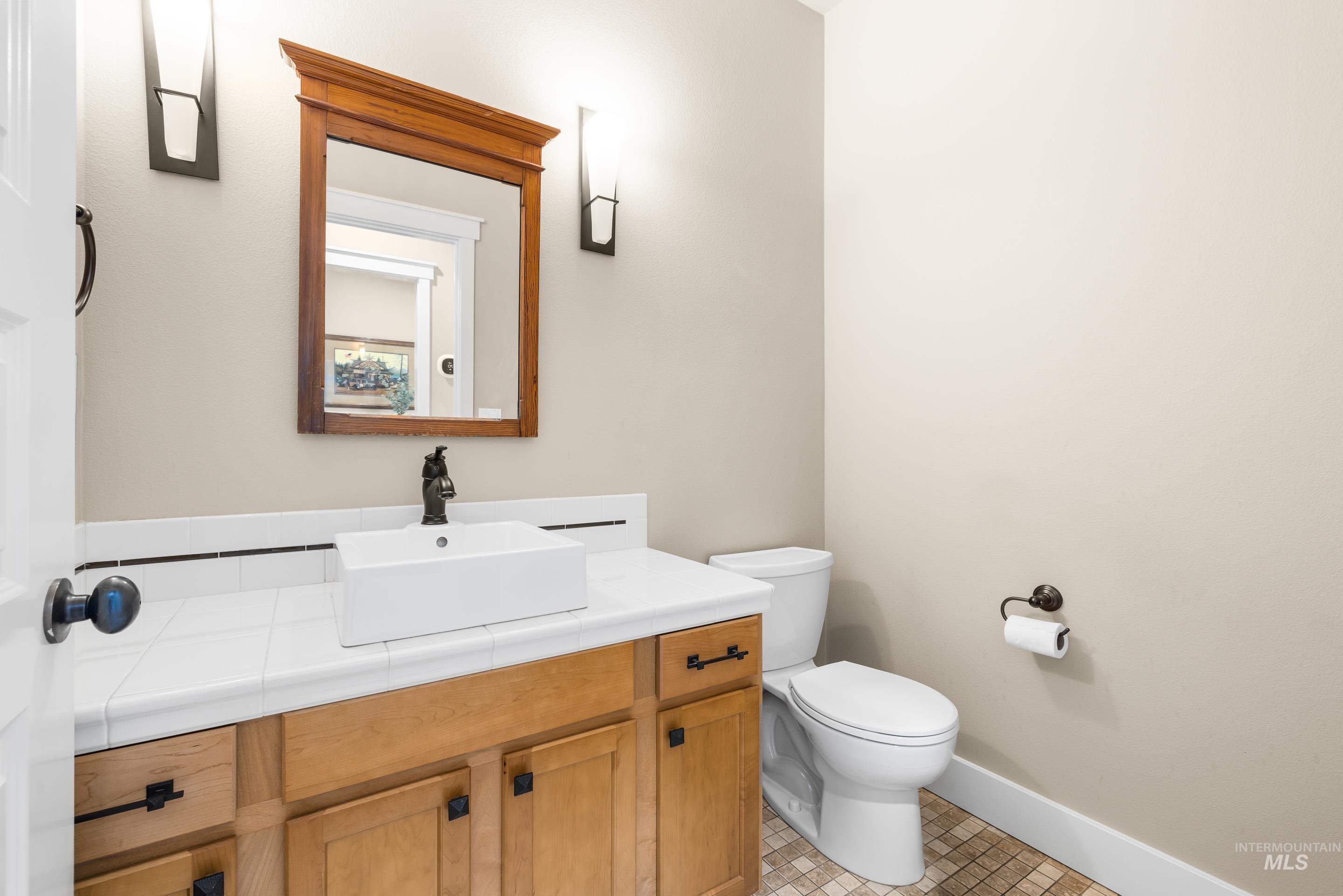 836 West Colbert Street Meridian, ID 83646 - Photo 10 of 45 Bathroom featuring vanity and light tile patterned floors