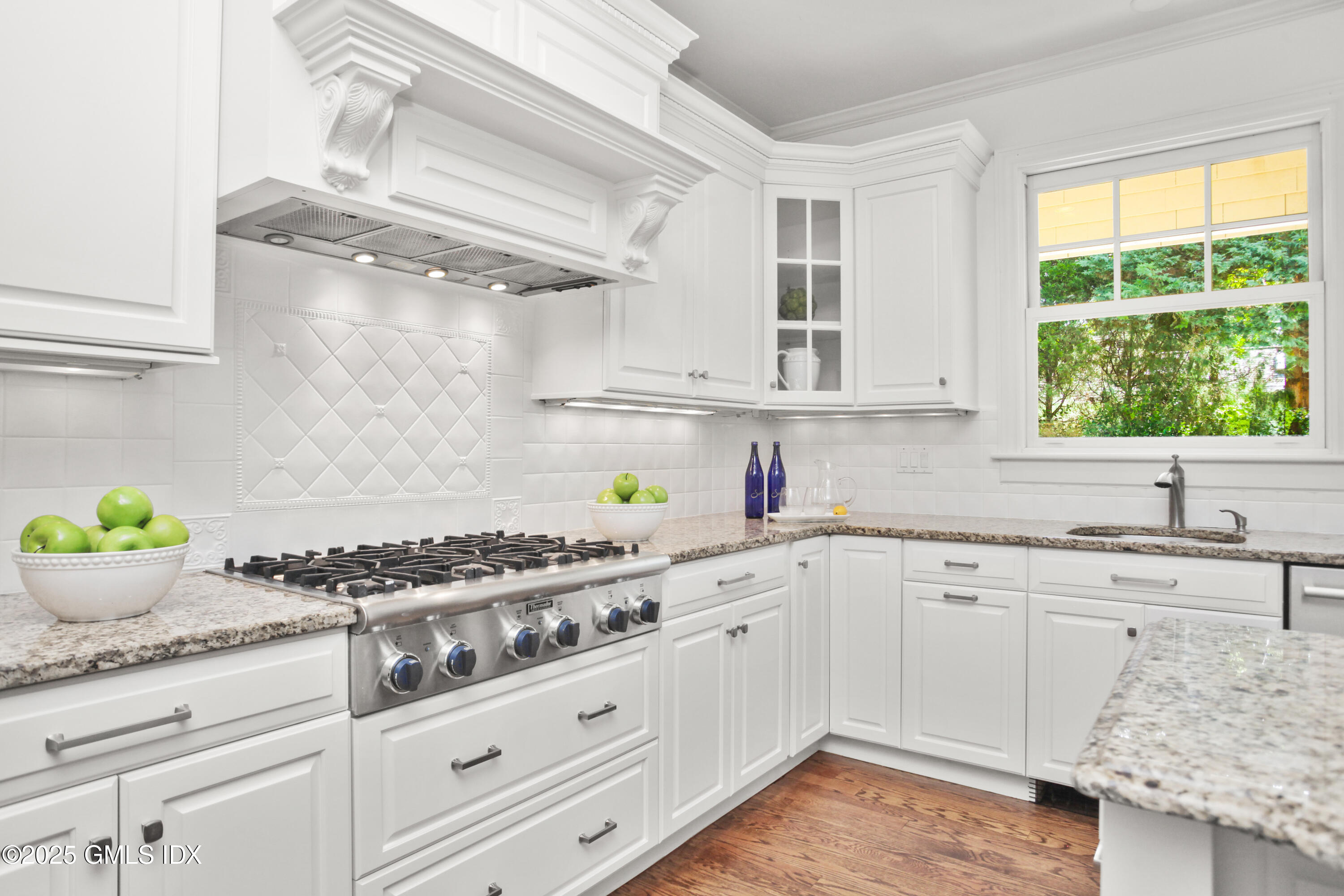 29 Weston Hill Road Riverside, CT 06878 - Photo 11 of 23 a kitchen with granite countertop a sink stove and cabinets