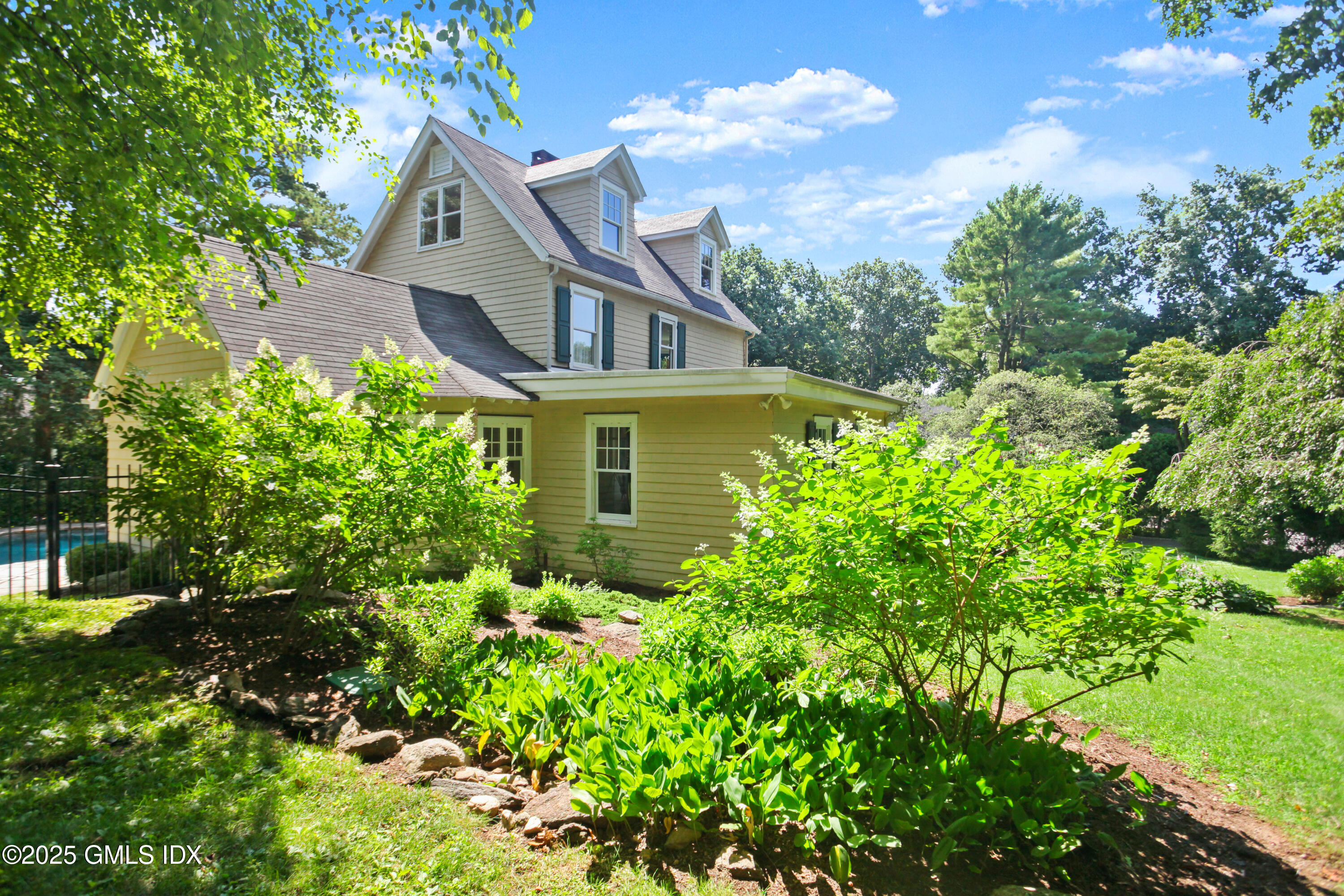 29 Weston Hill Road Riverside, CT 06878 - Photo 16 of 23 front view of a house with a yard