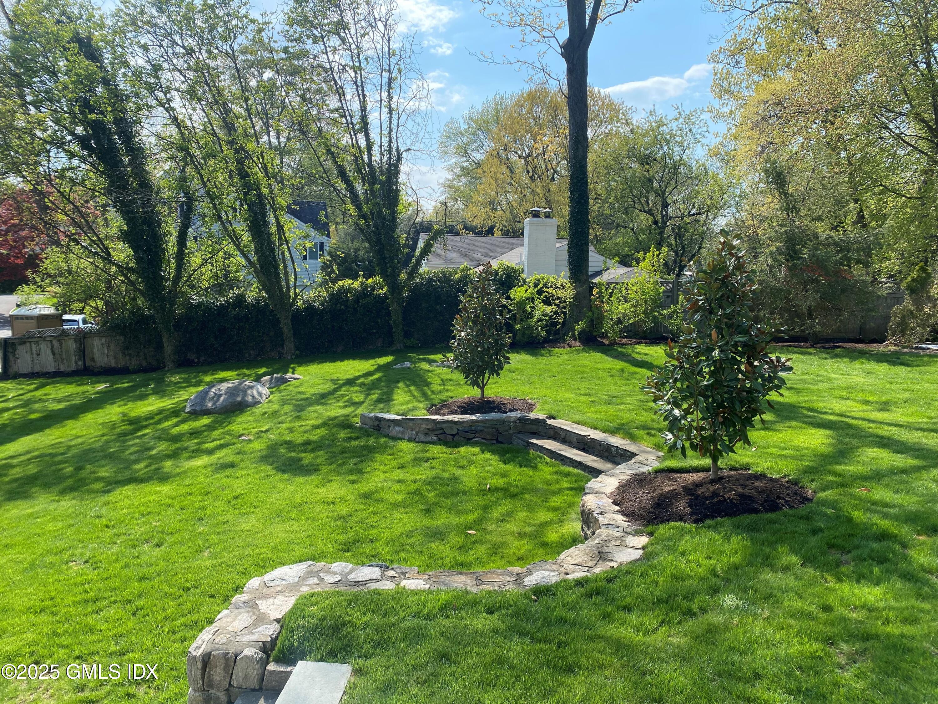 29 Weston Hill Road Riverside, CT 06878 - Photo 17 of 23 a view of a garden with a tree