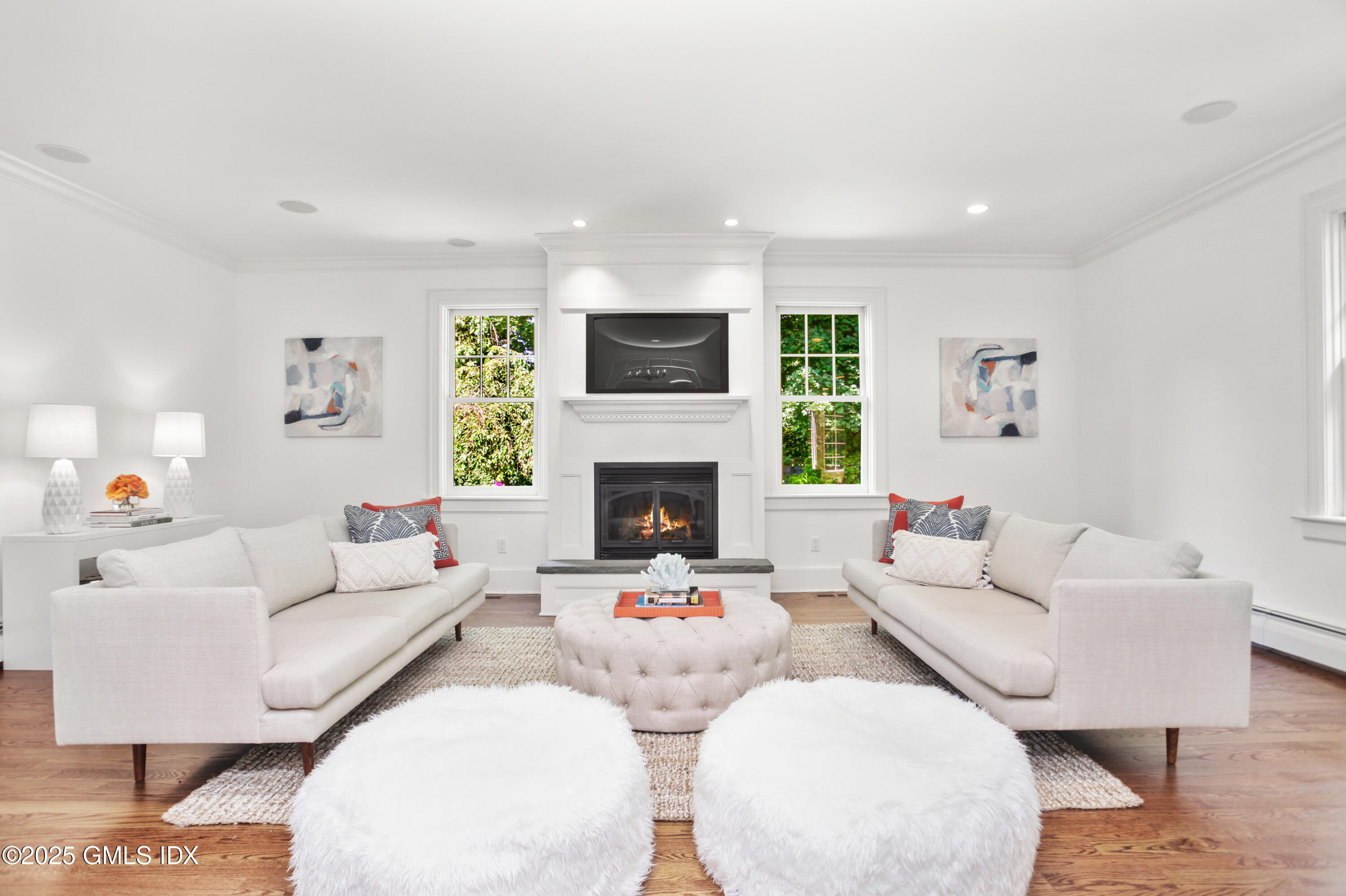 29 Weston Hill Road Riverside, CT 06878 - Photo 5 of 23 a living room with furniture and a fireplace