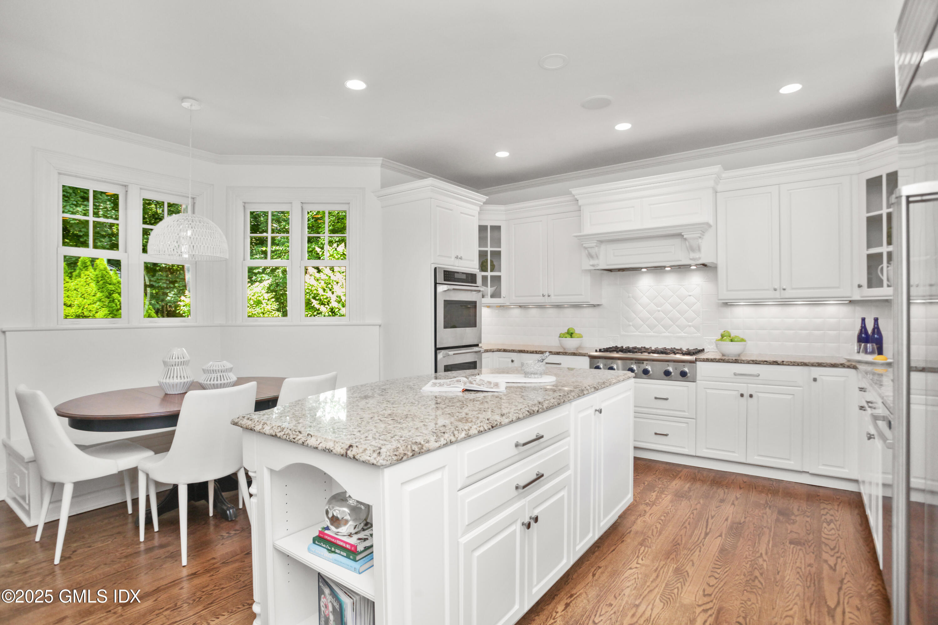 29 Weston Hill Road Riverside, CT 06878 - Photo 9 of 23 a open kitchen with granite countertop a sink and white cabinets