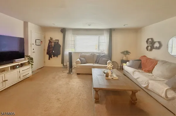a kitchen with a stove a sink a microwave and a refrigerator