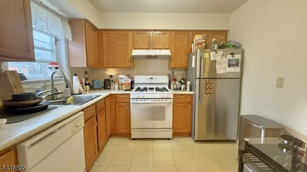 a room with a washing machine and sink