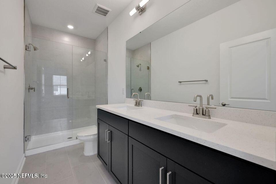 36 Thurnham Lane St. Augustine, FL 32092 - Photo 9 of 15 a bathroom with a bathtub shower sink double vanity and a mirror