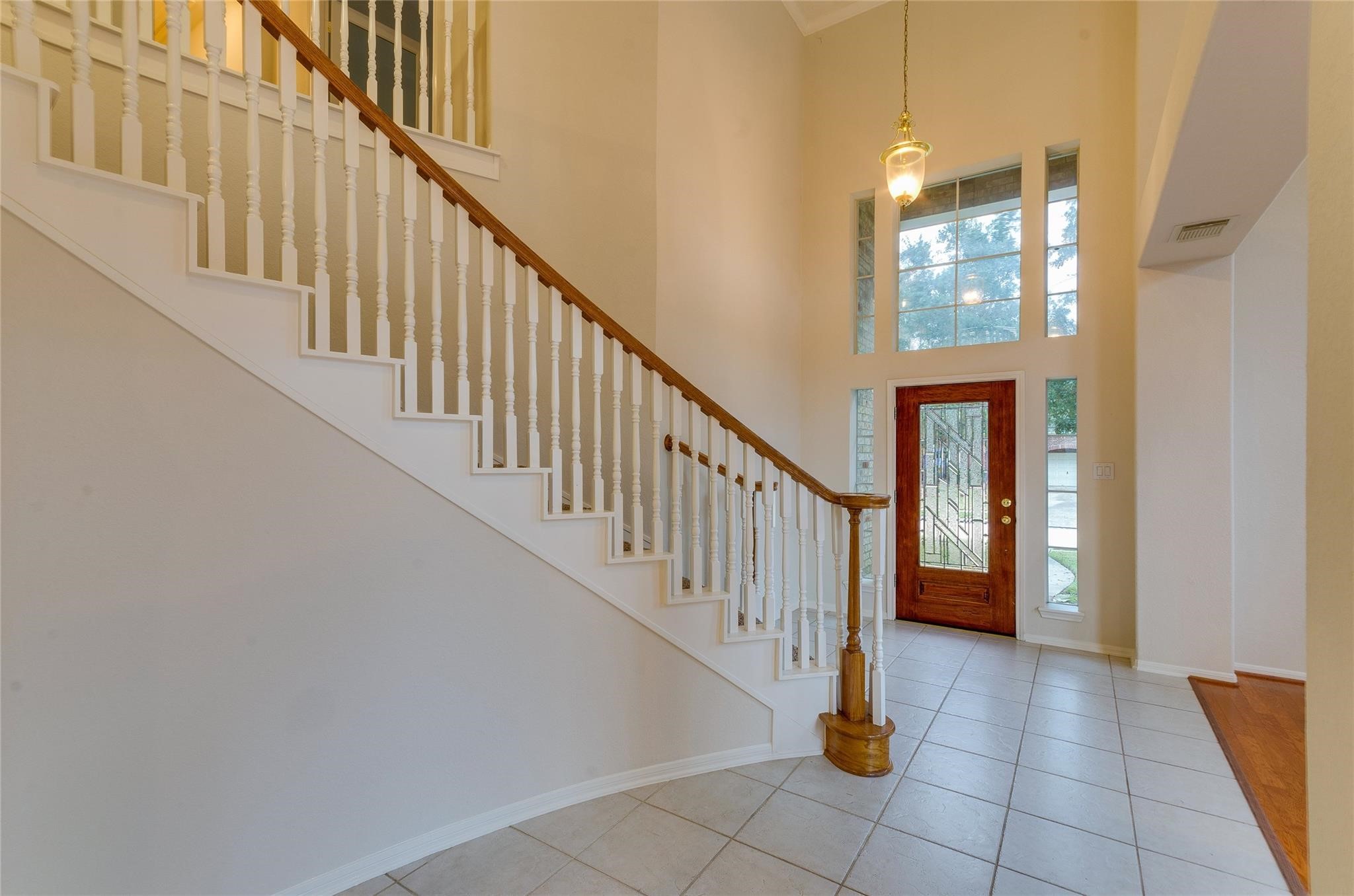 4019 Angel Spring Drive Sugar Land, TX 77479 - Photo 3 of 50 a view of staircase with lots of frames on wall and a window