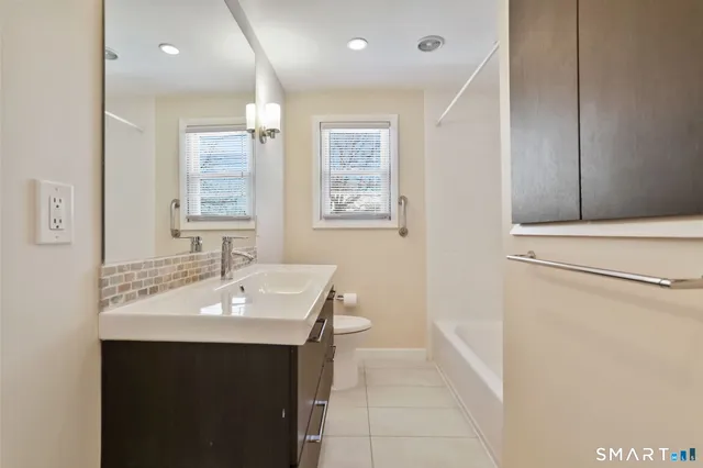 a view of a chairs and table in the patio