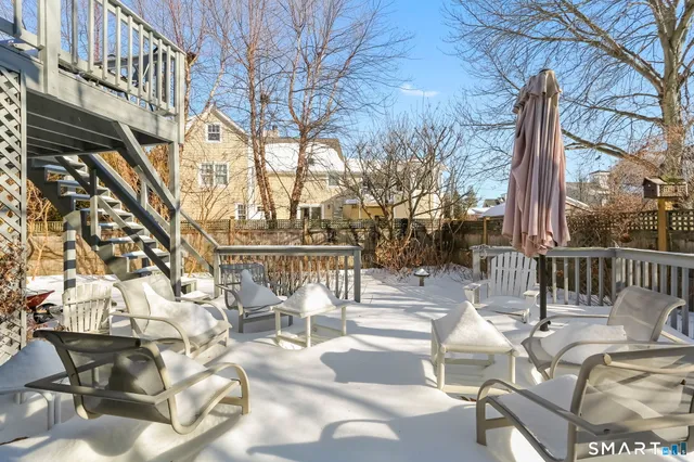 a view of a hall with an entrance to ceiling windows