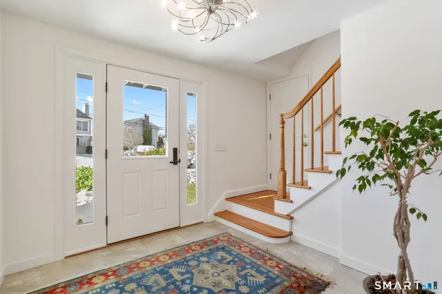 a living room with furniture and a rug