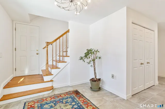 a view of an empty room and fire place
