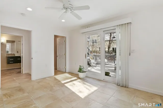 a view of an empty room and a window