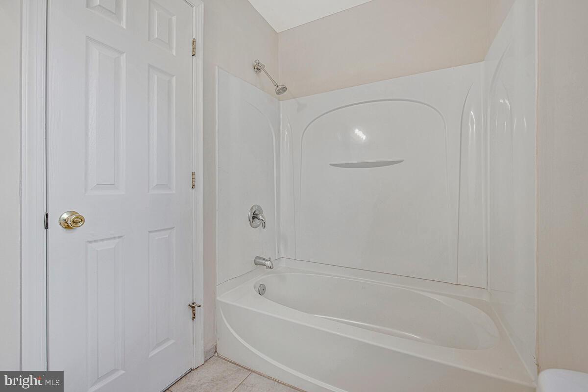 7712 Frederick Road Hyattsville, MD 20784 - Photo 18 of 30 a close view of a bathtub in a corridor