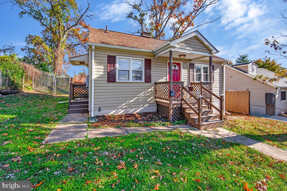 7712 Frederick Road Hyattsville, MD 20784 - Photo 2 of 30 a view of a house with backyard and a tree