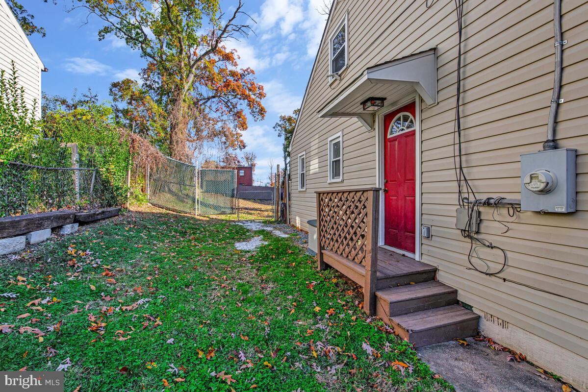 7712 Frederick Road Hyattsville, MD 20784 - Photo 25 of 30 a view of a street with potted plants and large tree