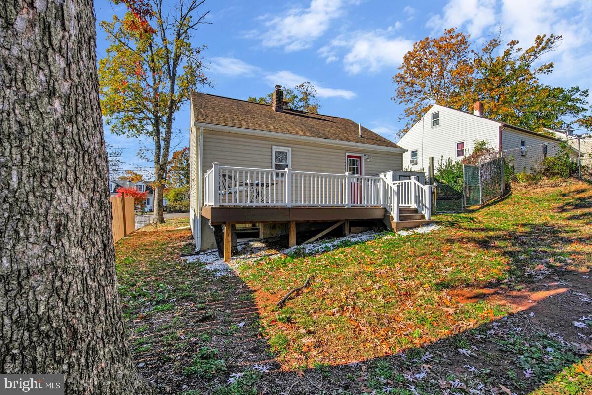 7712 Frederick Road Hyattsville, MD 20784 - Photo 28 of 30 a view of a house with a large tree and a yard