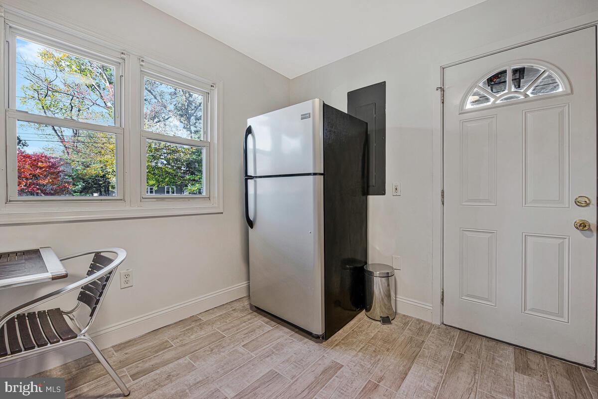 7712 Frederick Road Hyattsville, MD 20784 - Photo 9 of 30 a view of a livingroom with furniture and a window