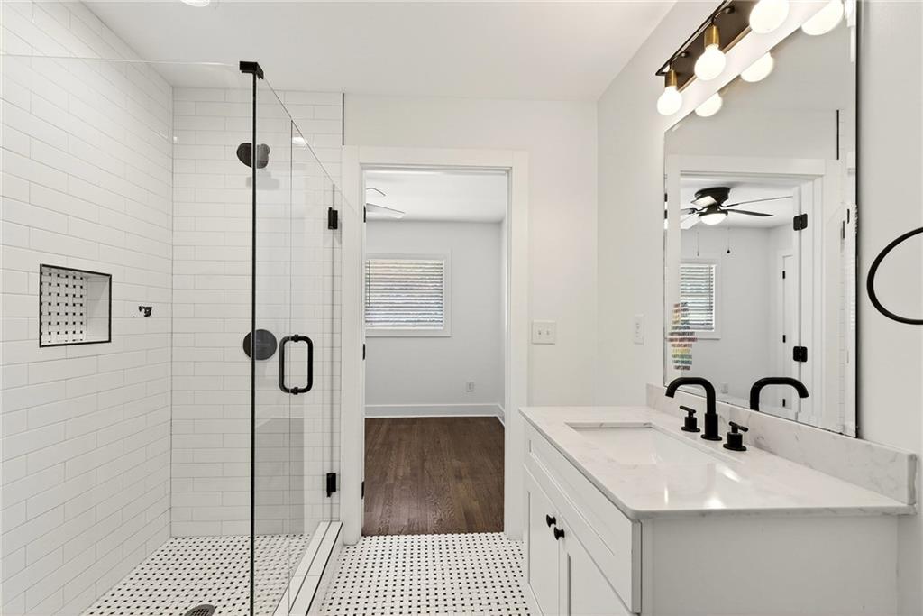 1344 Midlawn Drive Decatur, GA 30032 - Photo 63 of 87 a bathroom with a sink a granite tub and shower