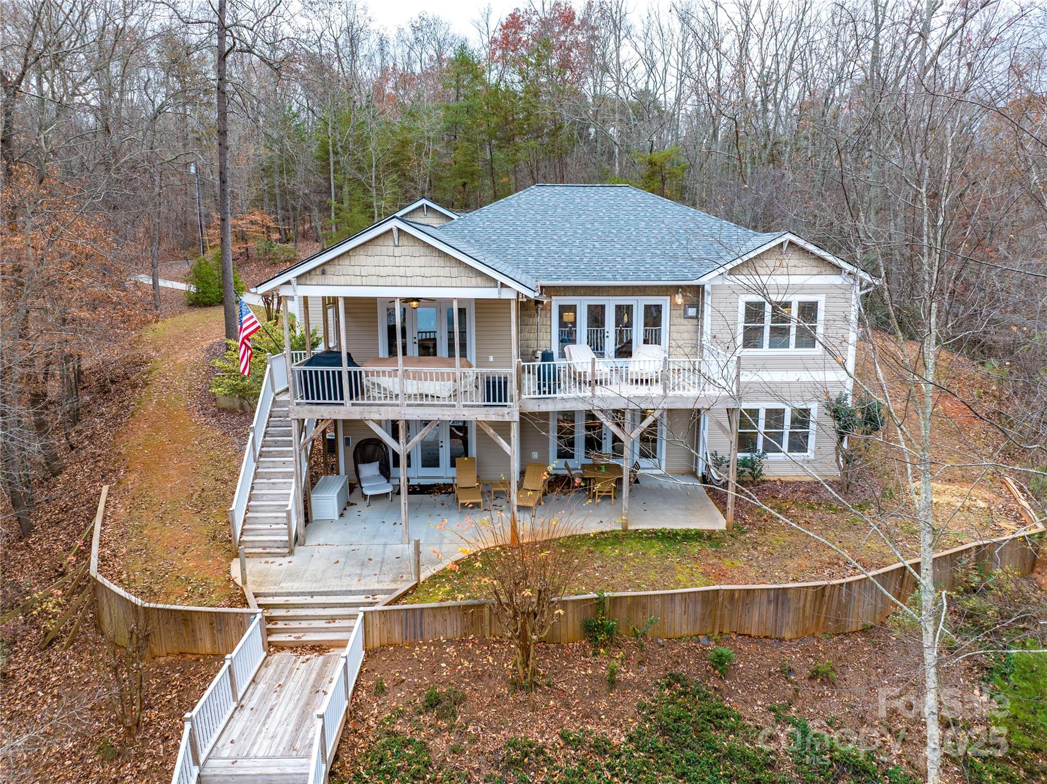 an aerial view of a house with swimming pool and porch