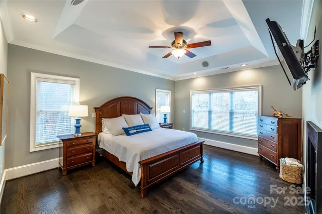 a bedroom with a bed and a fireplace