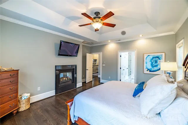 a bedroom with a bed and a fireplace