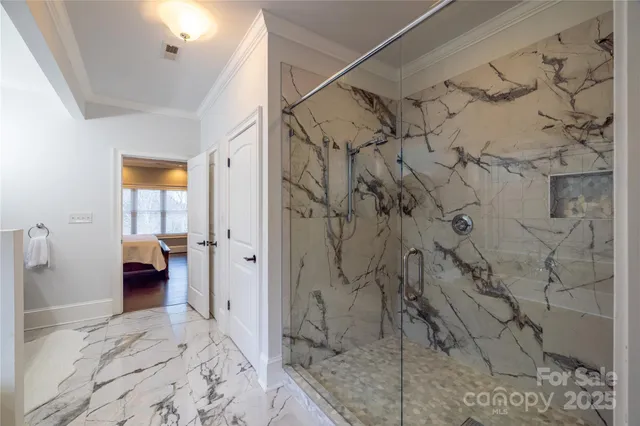 a bath room with a bath tub and a large window