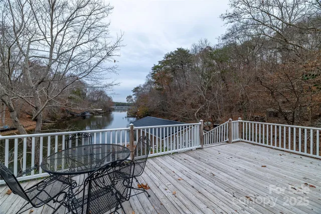 a view of a house with wooden deck