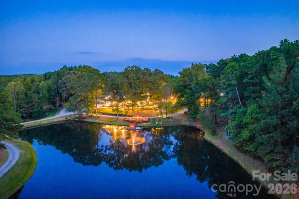 an aerial view of a house swimming pool and outdoor space