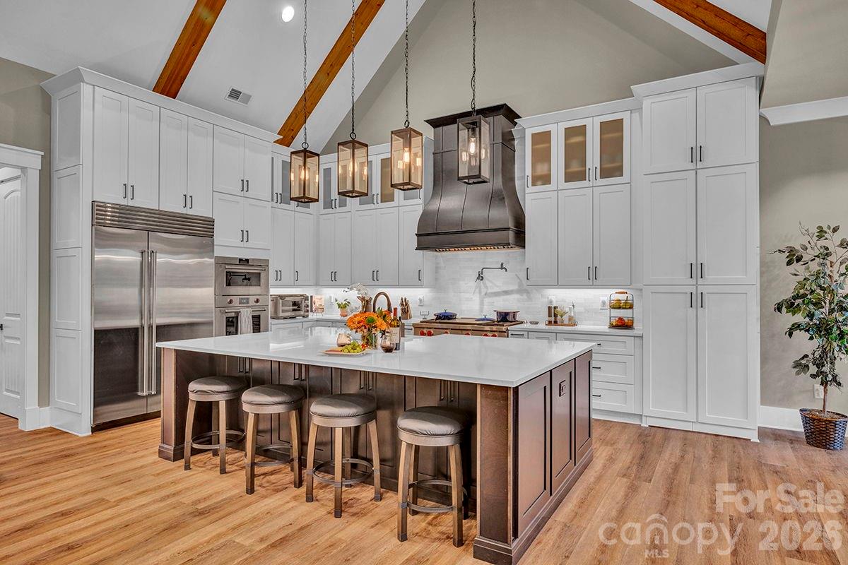 1619 Ellis Belk Road Monroe, NC 28112 - Photo 11 of 47 a kitchen with granite countertop a sink appliances and wooden floor