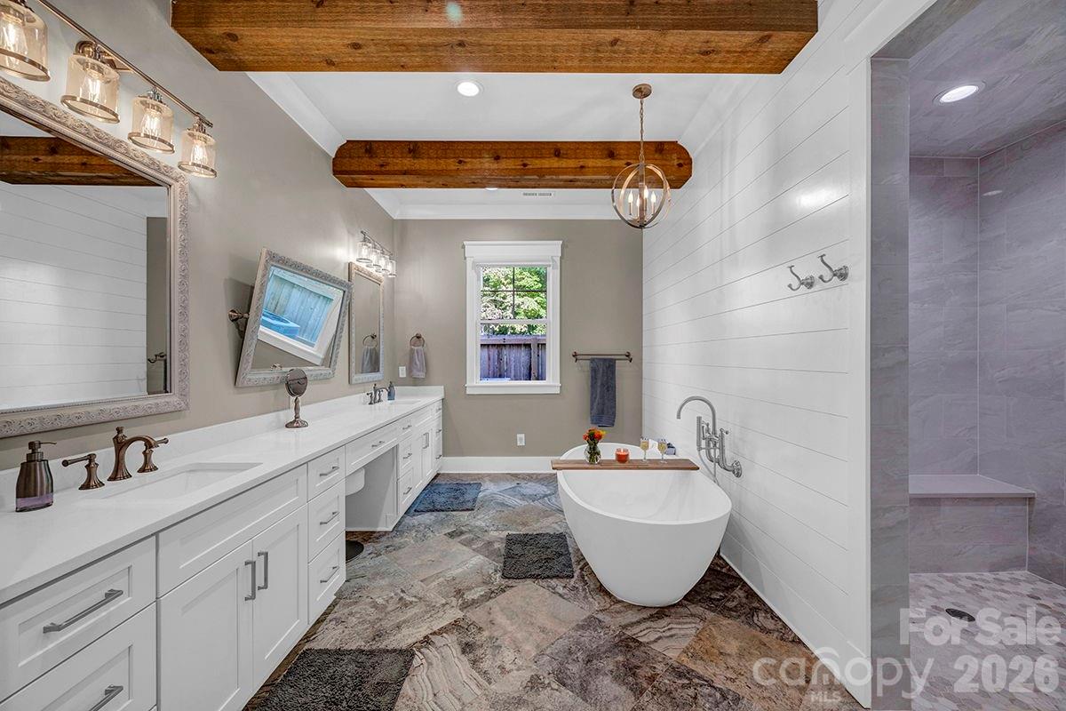 1619 Ellis Belk Road Monroe, NC 28112 - Photo 14 of 47 a bathroom with a granite countertop sink and a mirror