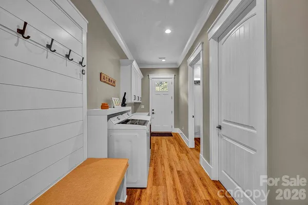 a spacious bedroom with a bed and a window